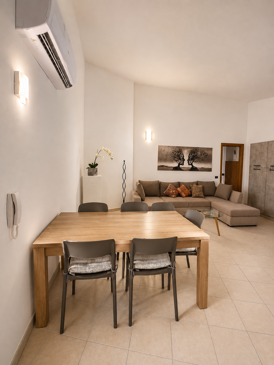 Open-plan lounge, dining and kitchen room with oak table for six and L-shaped sofa